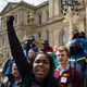 People protest the end of the Flint’s water distribution program in Lansing, Michigan.